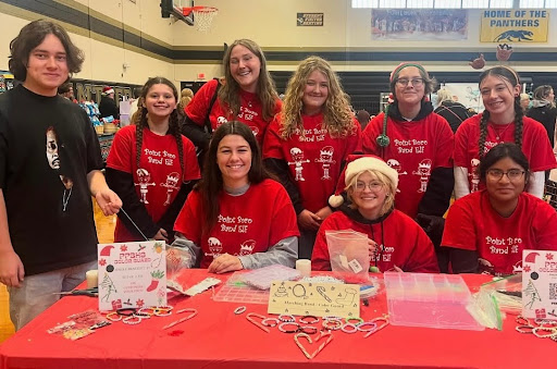 Students help sell bracelets at the color guard''s booth at the Craft Fair!
Left to right (standing): Aedan O., Gabby M., Payton S., Gracie H., Ava O., April H.,
(sitting): Annie W., Kipp S., Lizeth L.